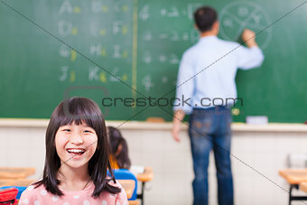 happy student in class with teacher