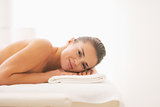 Young woman laying on massage table