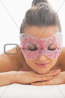 Portrait of young woman with eye mask