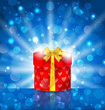 Round gift box on light background with glow