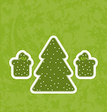 Green paper cut-out christmas tree fnd gifts