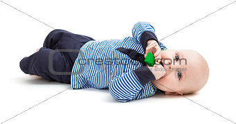 toddler with toy on floor