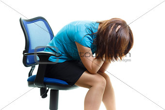 upset and tired girl on a chair on a white background
