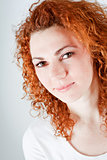 attractive young redhead woman smiling portrait