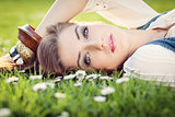 beautiful woman lying in grass in summer 