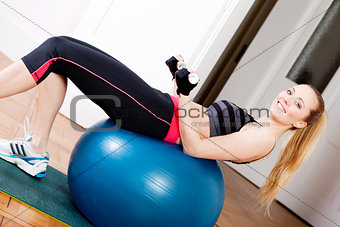 attractive young woman doing fitness dumbbell