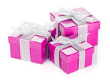 Three purple gift boxes with silver ribbon and bow