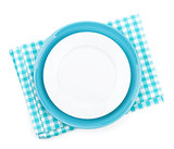 Empty plates over kitchen towel