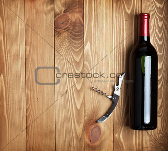 Red wine bottle and corkscrew