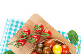 Colorful cherry tomatoes on cutting board
