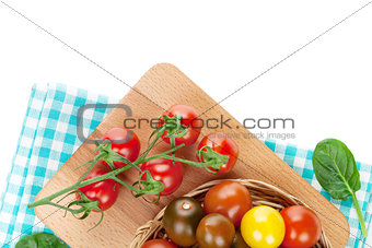 Colorful cherry tomatoes on cutting board
