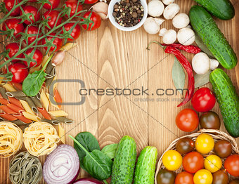 Fresh ingredients for cooking: pasta, tomatoes, cucumbers, mushr