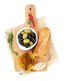 Italian food appetizer of olives, bread, olive oil and spices