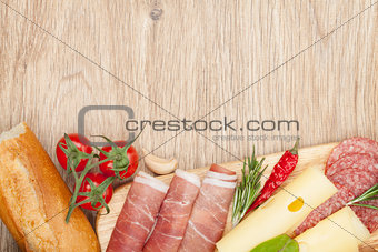 Cheese, prosciutto, bread, vegetables and spices