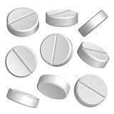 Set of white medical pills in different positions