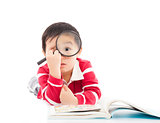 surprised kid is holding magnifying glass