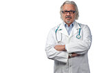 caucasian mature male doctor on bright background