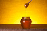 Honey jar with wooden dipper 