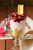 dairy dessert trifle with cherry in a glass