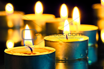 bright flame burning small candles