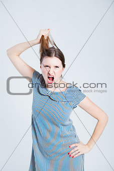 Attractive woman pulling her hair