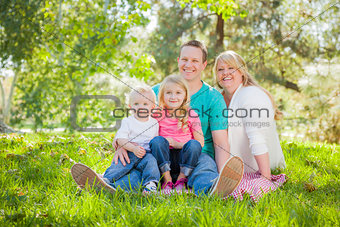 Young Attractive Family Portrait in the Park