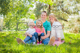 Young Attractive Family Portrait in the Park