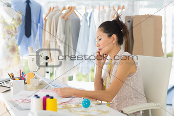 Female fashion designer working on her designs