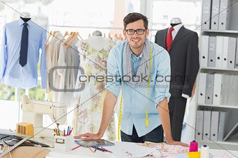 Portrait of a smiling handsome male fashion designer
