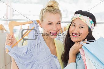 Young women shopping in clothes store