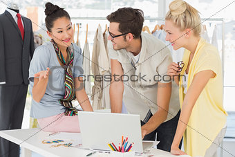 Fashion designers using laptop