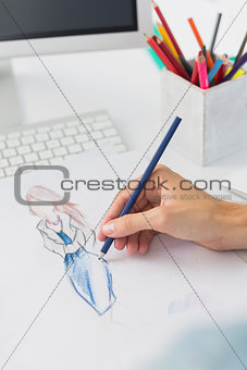 Extreme closeup of a fashion designer working on designs
