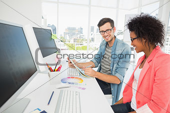 Casual young couple working on computer