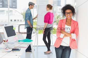 Casual female artist with colleagues in at office