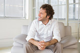 Relaxed well dressed man sitting at home