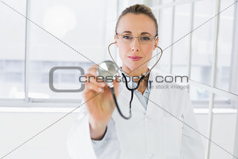 Female doctor with stethoscope in hospital