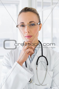 Serious beautiful female doctor in hospital
