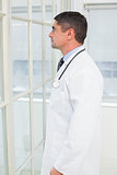 Side view of a thoughtful male doctor