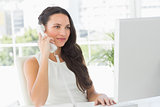 Beautiful businesswoman on telephone at her desk