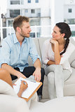 Unhappy couple talking at therapy session