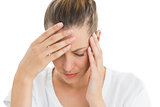 Woman having a headache with her head in her hands