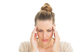 Woman with headache touching her temples