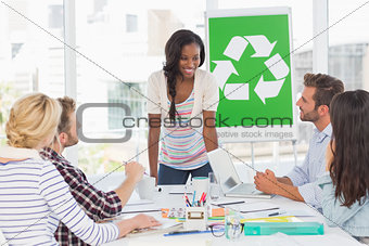 Smiling young team having a meeting about recycling policy
