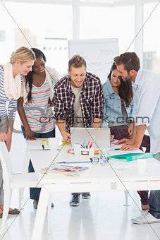Happy team of designers having a meeting