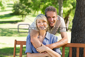 Man embracing woman from behind