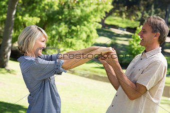 Romantic couple dancing in park