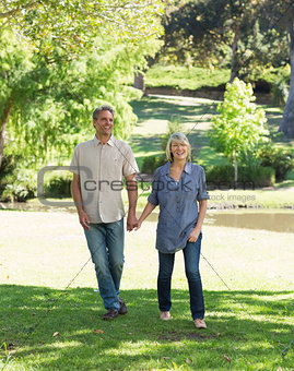 Couple walking in park