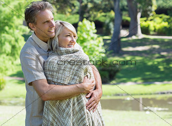 Loving couple embracing in park