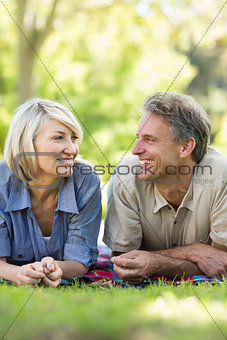Couple looking at each other in park