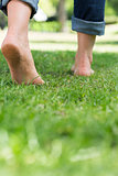 Woman walking on grassy land